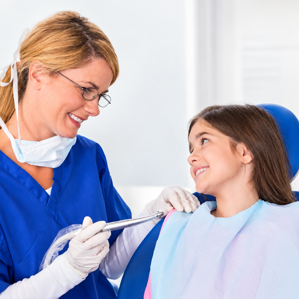 Dentist offering gentle care to a young patient